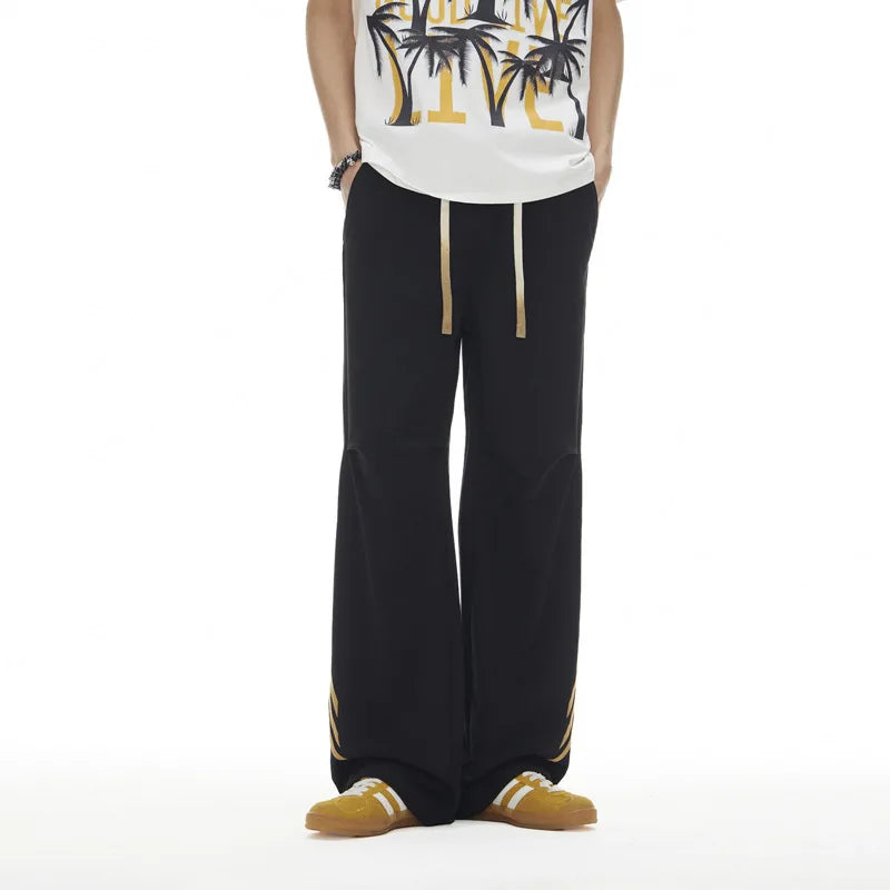 Pantalones deportivos casuales holgados con cordón elástico