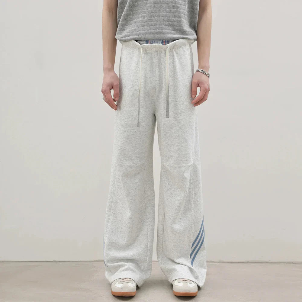 Pantalones deportivos casuales holgados con cordón elástico