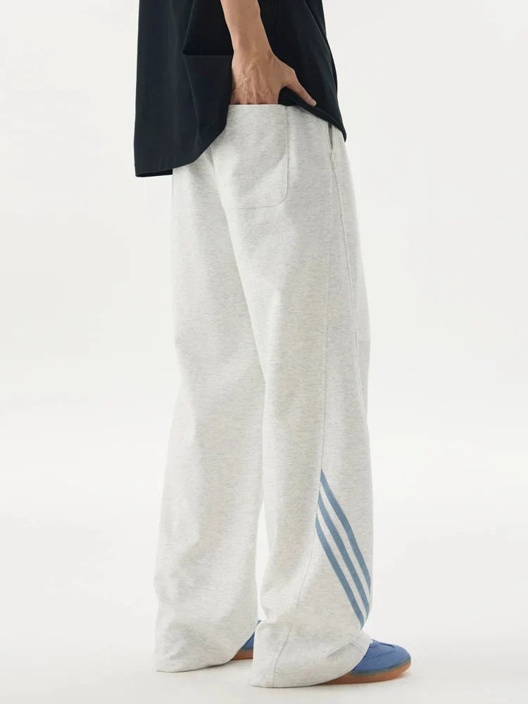 Pantalones deportivos casuales holgados con cordón elástico