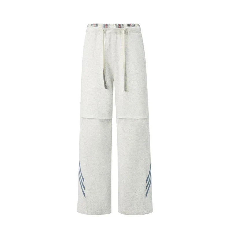 Pantalones deportivos casuales holgados con cordón elástico
