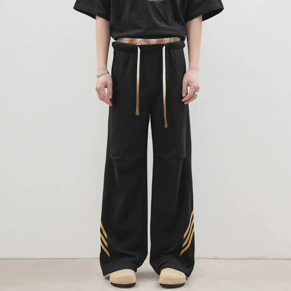 Pantalones deportivos casuales holgados con cordón elástico