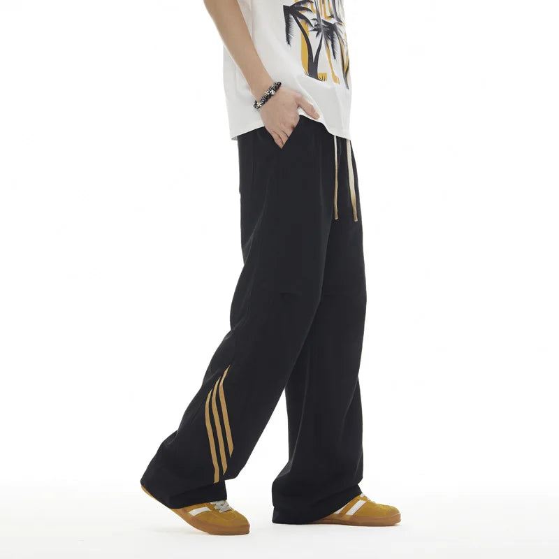 Pantalones deportivos casuales holgados con cordón elástico