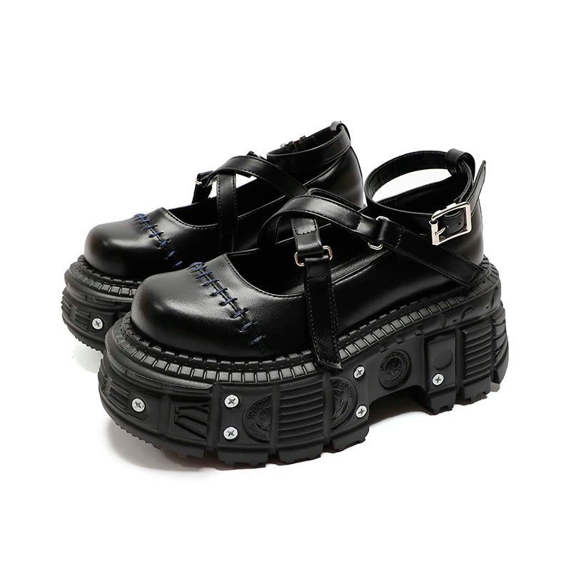 Zapatos de cuero negro con cinturón cruzado