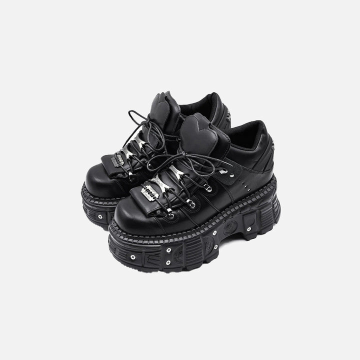 Front view of the black Heart-Tongue Platform Sneakers in a gray background