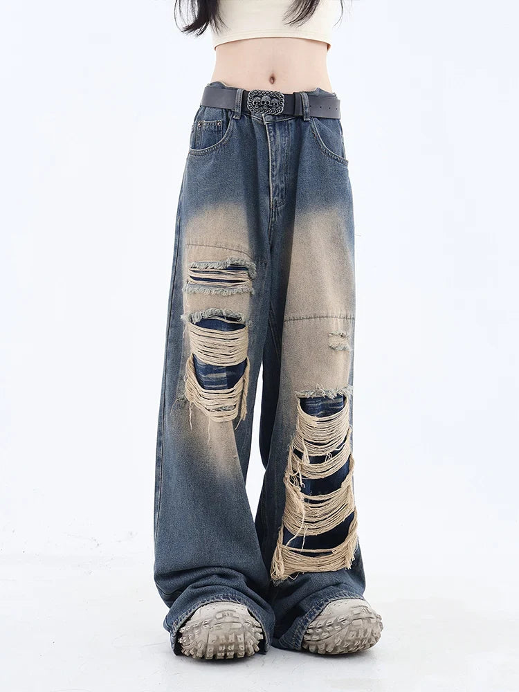 Model wearing the blue Shredded Relaxed denim Jeans