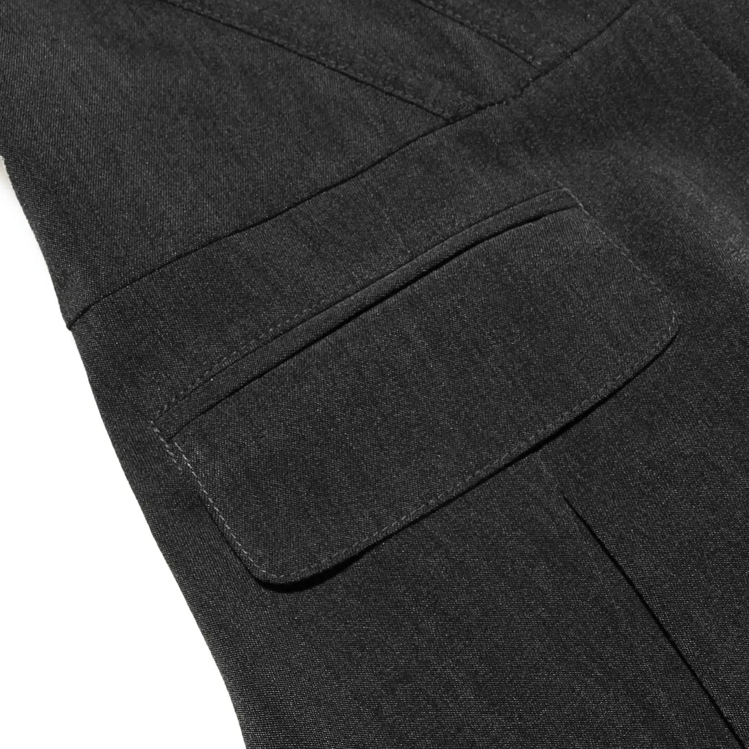 Close-up of a dark gray fabric with a pocket detail on a white background