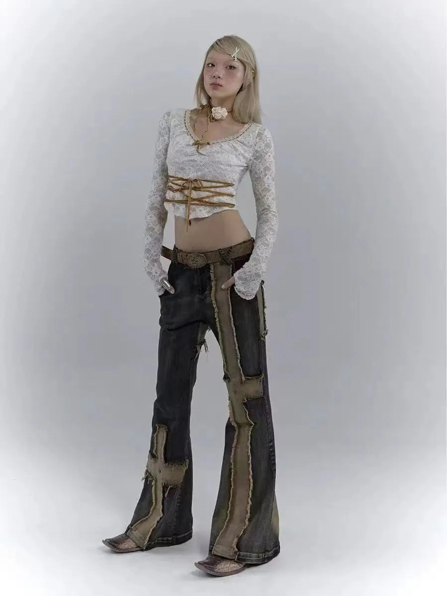 Model wearing the blue Distressed Patchwork Cross Jeans