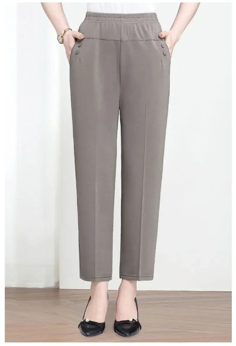 Person wearing gray pants on a white background