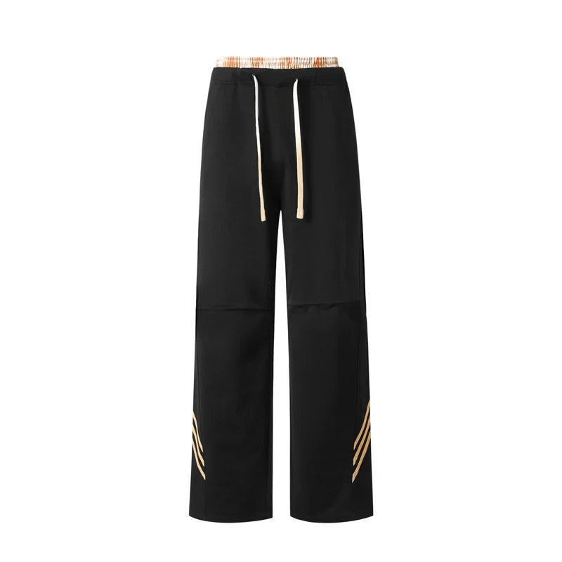 Pantalones deportivos casuales holgados con cordón elástico