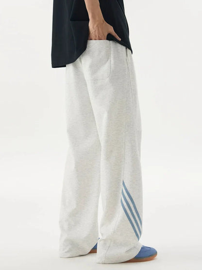 Pantalones deportivos casuales holgados con cordón elástico