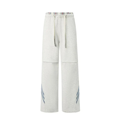 Pantalones deportivos casuales holgados con cordón elástico