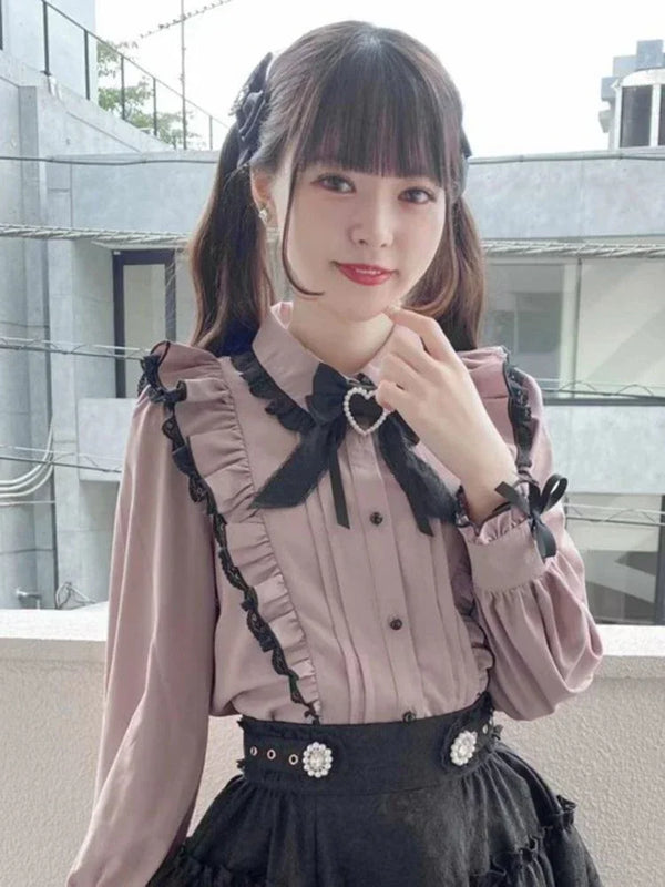 Blusa con lazo y volantes de encaje rosa