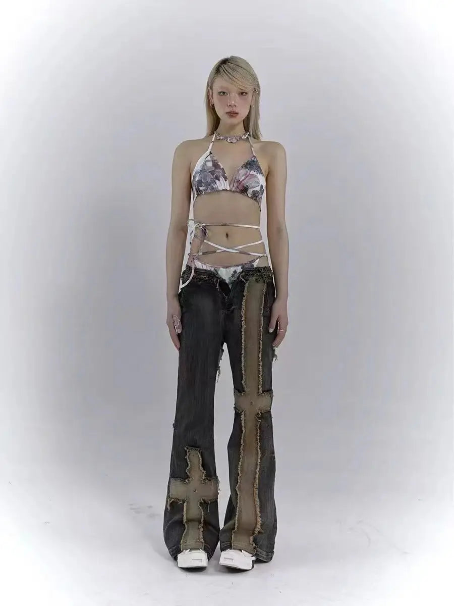 Model wearing the blue Distressed Patchwork Cross Jeans
