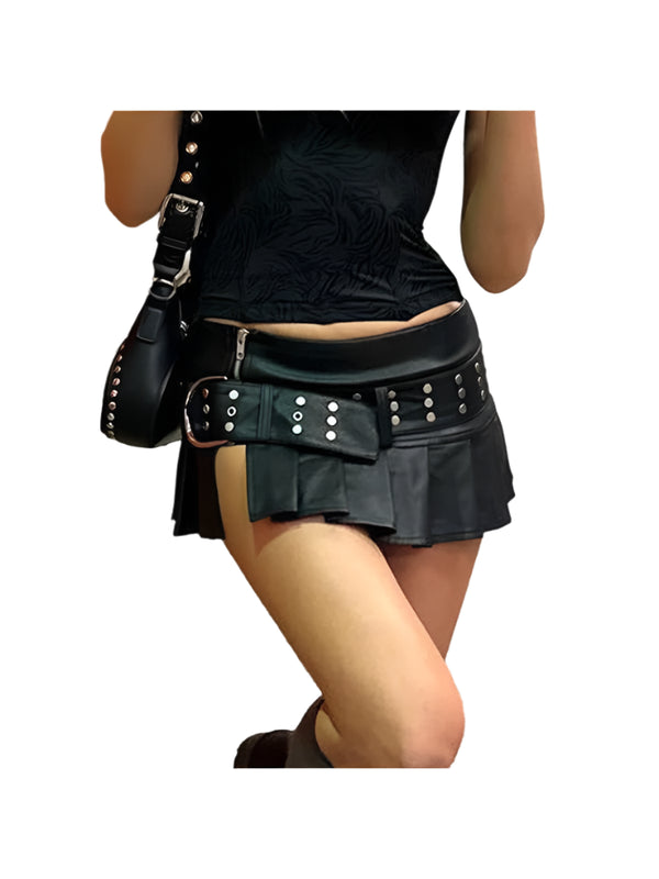 Person wearing a black leather skirt with studded details on a street.