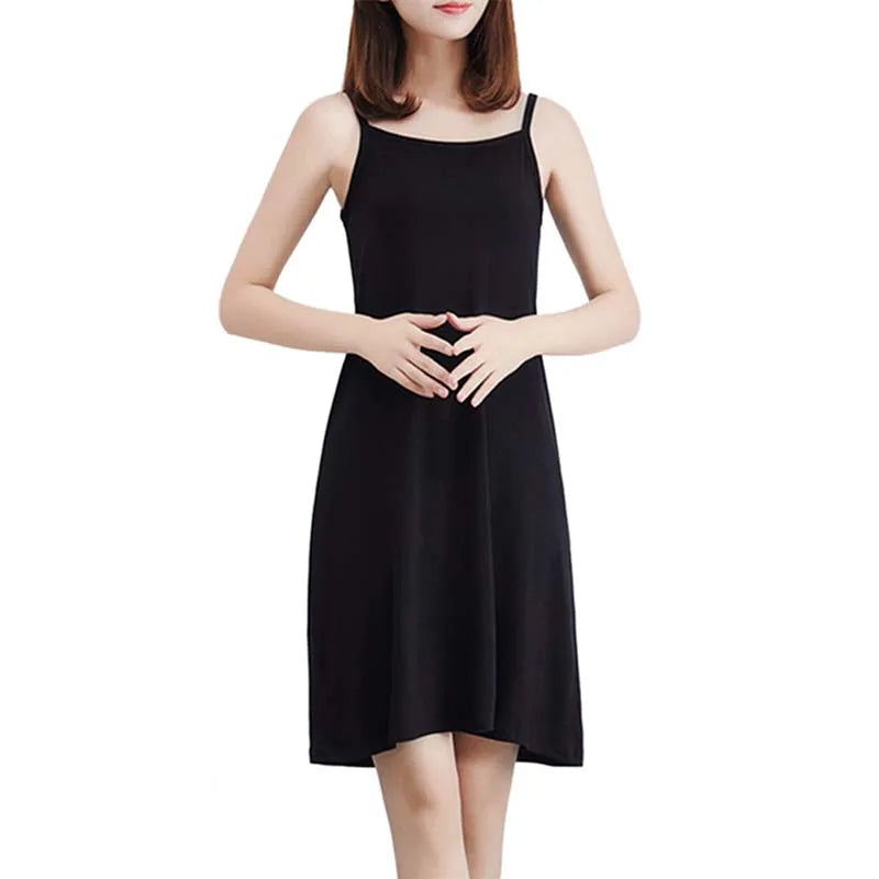 Black sleeveless dress worn by a model on a white background